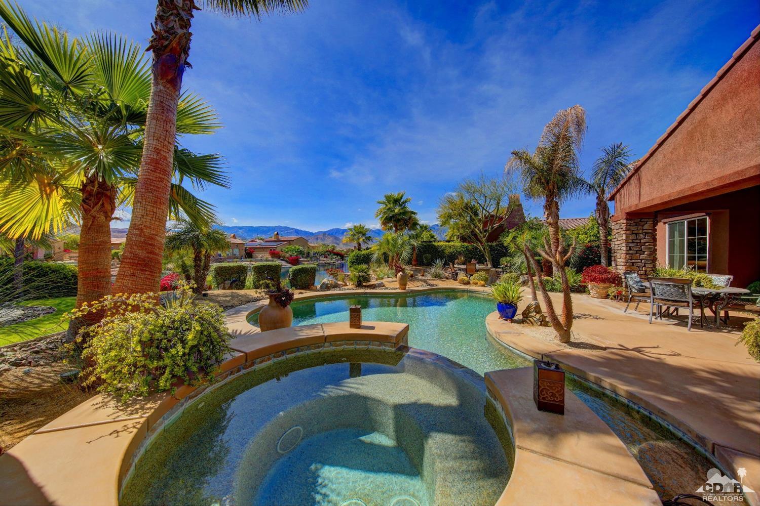 5 Via Santa Velera Rancho Mirage, CA 92270 - Photo 57 of 90 a view of a swimming pool with outdoor seating