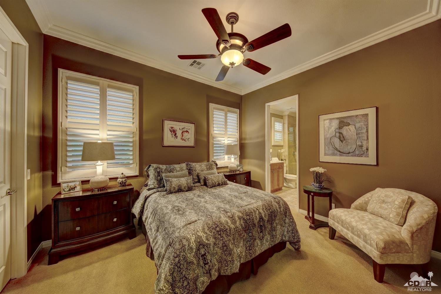 5 Via Santa Velera Rancho Mirage, CA 92270 - Photo 9 of 90 a bedroom with a bed and a chandelier