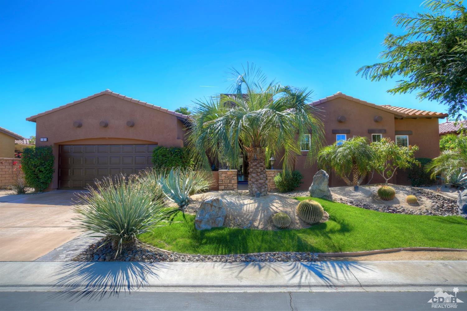 5 Via Santa Velera Rancho Mirage, CA 92270 - Photo 89 of 90 a palm tree sitting in front of a house with a yard