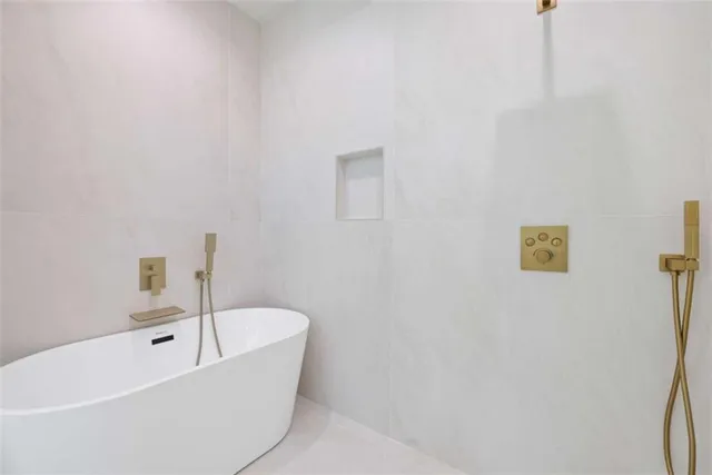 a kitchen with stainless steel appliances a cabinets and a stove top oven