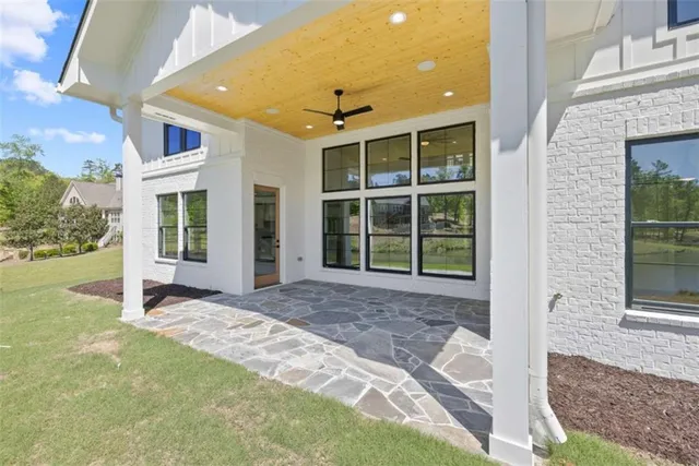a view of staircase with white walls and windows