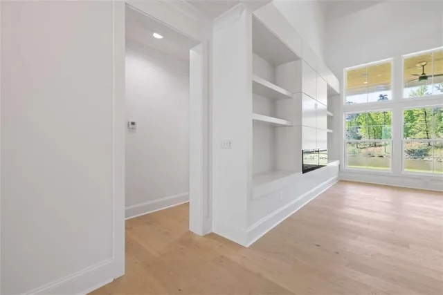 a view of an empty room with a window