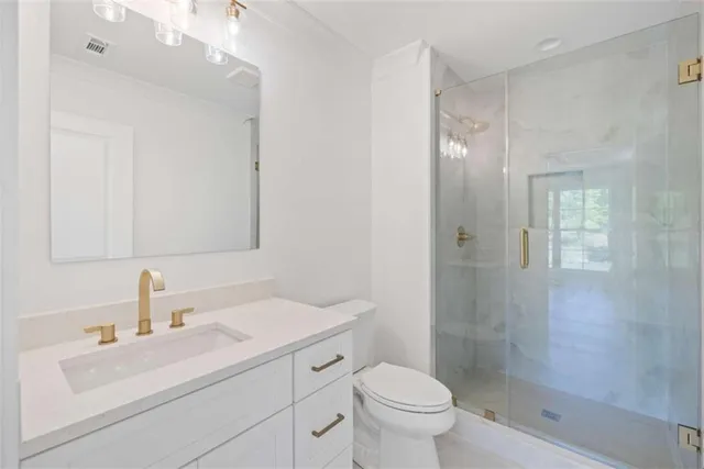 a view of a house with a yard and potted plants