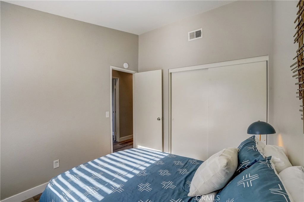 39429 Long Ridge Drive Temecula, CA 92591 - Photo 13 of 23 a bedroom with a bed and a lamp