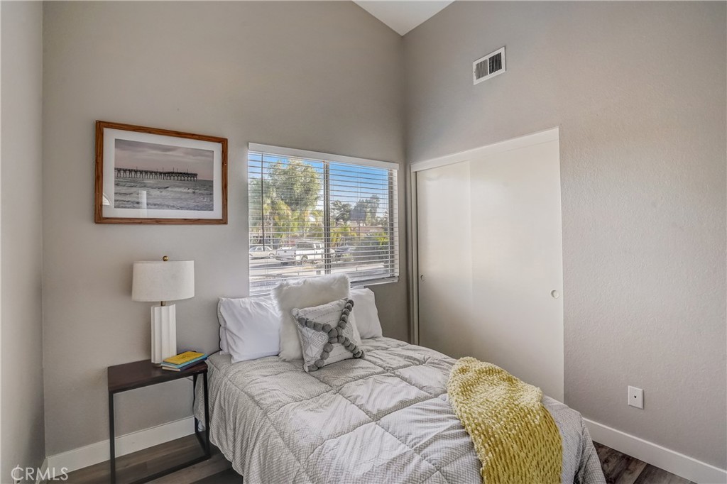 39429 Long Ridge Drive Temecula, CA 92591 - Photo 14 of 23 a bedroom with a bed and a painting on the wall