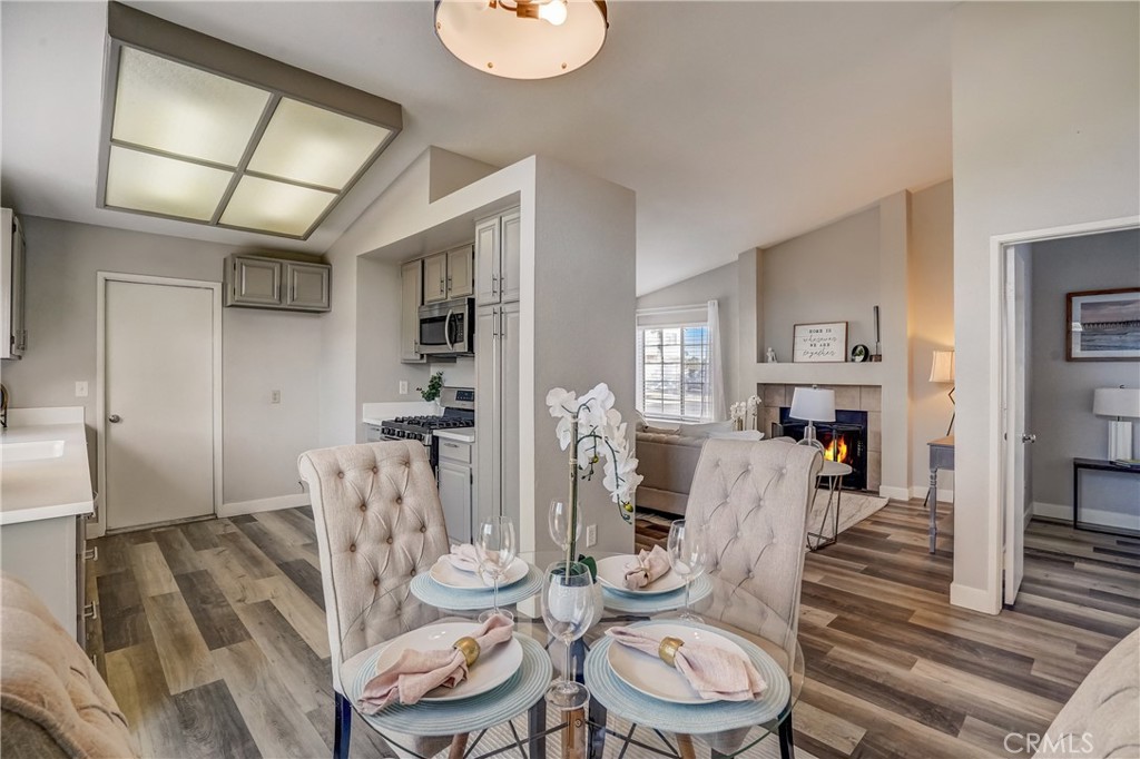 39429 Long Ridge Drive Temecula, CA 92591 - Photo 6 of 23 a living room with furniture a fireplace and wooden floor