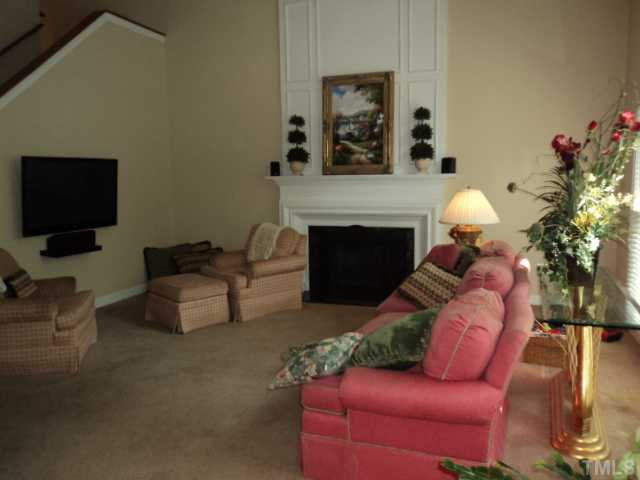 1509 Pecore Place Raleigh, NC 27615 - Photo 9 of 21 Family room with vaulted ceiling. This home two sets of stairs. Den/Family/Great Room