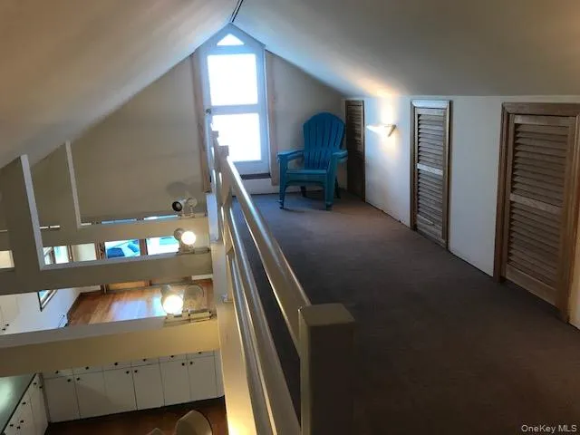 a view of living room with furniture and a flat screen tv