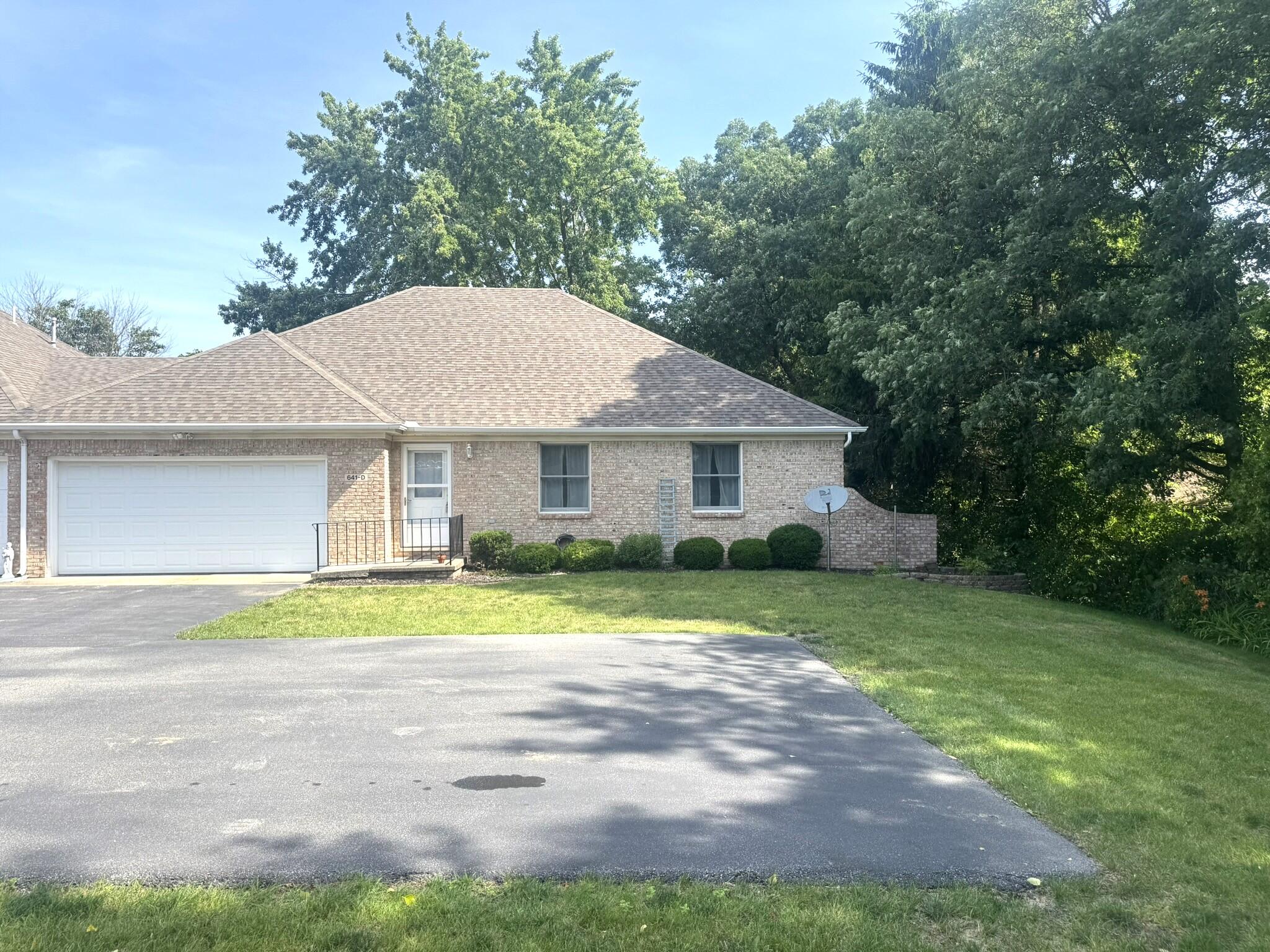 641 D Begonia Street Southeast De Motte, IN 46310 - Photo 1 of 39 a front view of a house with a yard and garage