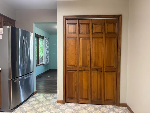 a large bathroom with a sink and a large mirror