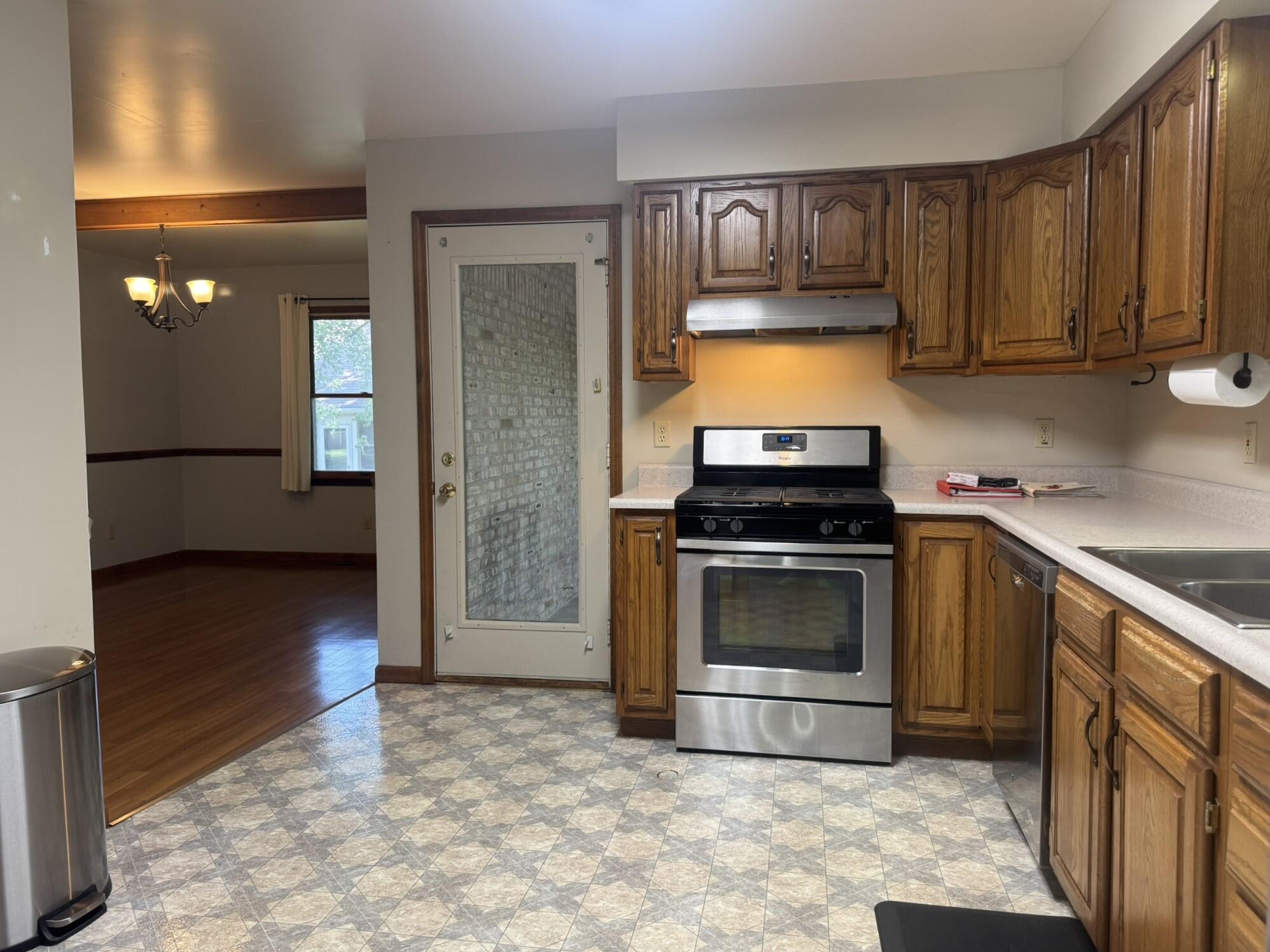 641 D Begonia Street Southeast De Motte, IN 46310 - Photo 18 of 39 a kitchen with a stove and a refrigerator