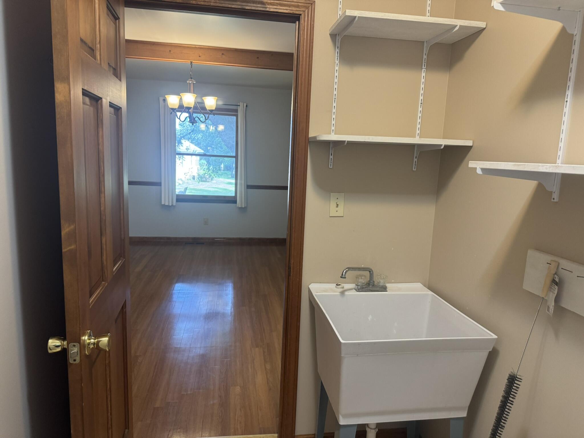 641 D Begonia Street Southeast De Motte, IN 46310 - Photo 24 of 39 a bathroom with a sink a light fixture and a mirror