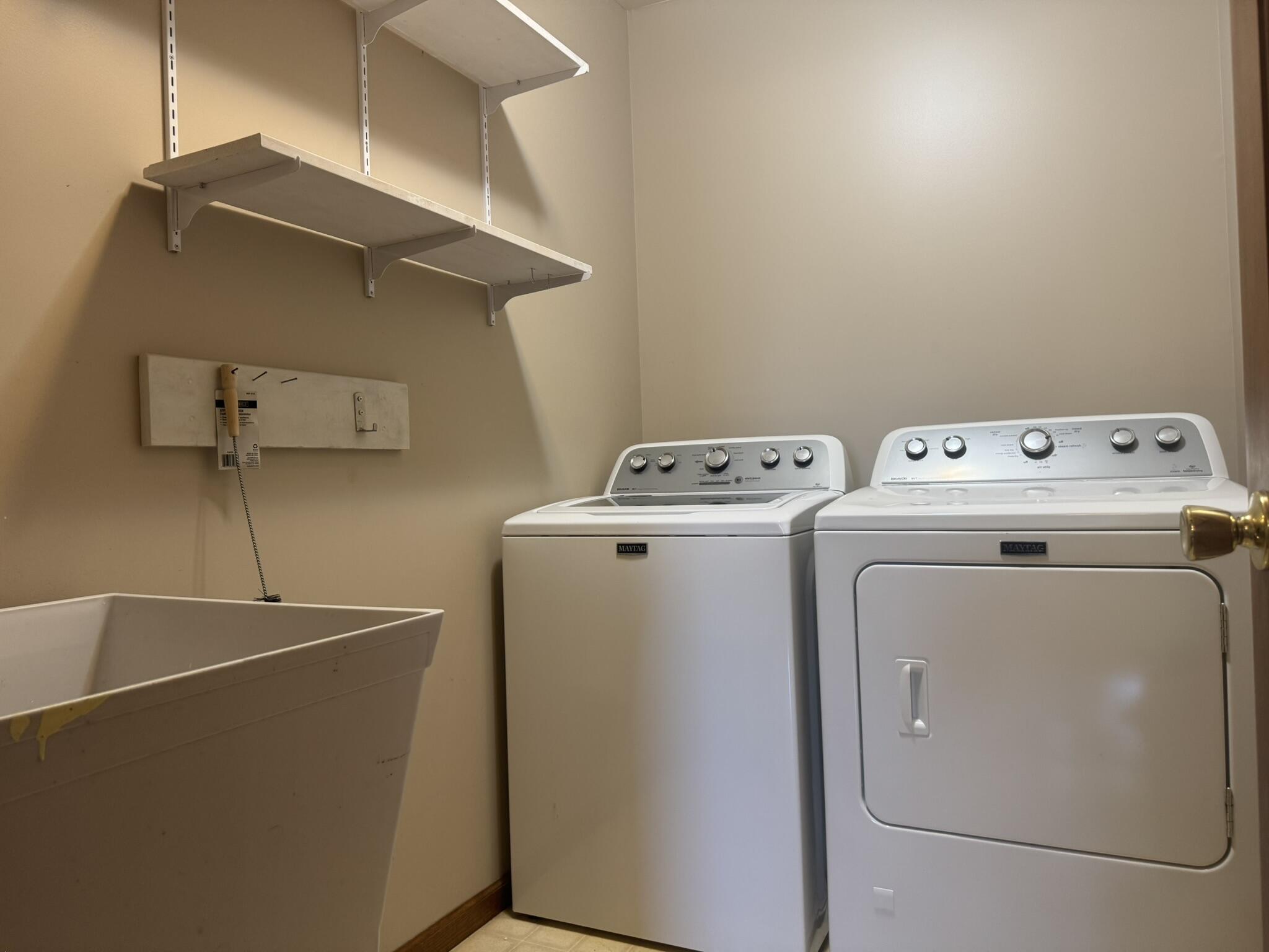 641 D Begonia Street Southeast De Motte, IN 46310 - Photo 25 of 39 a utility room with dryer and washer