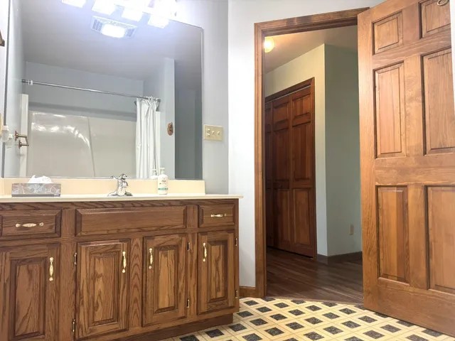 a bathroom with a sink a bath tub and a shower