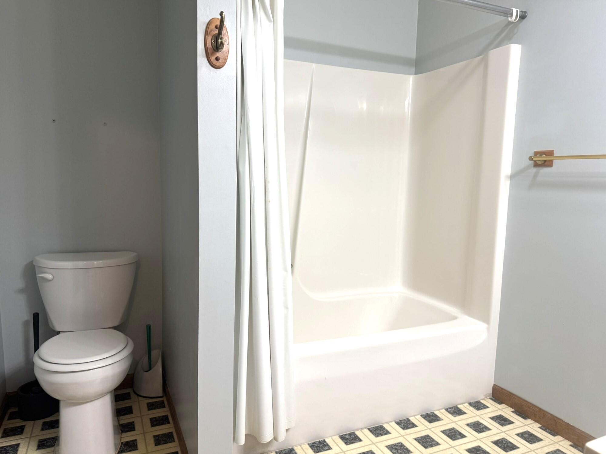 641 D Begonia Street Southeast De Motte, IN 46310 - Photo 28 of 39 a bathroom with a toilet and a shower