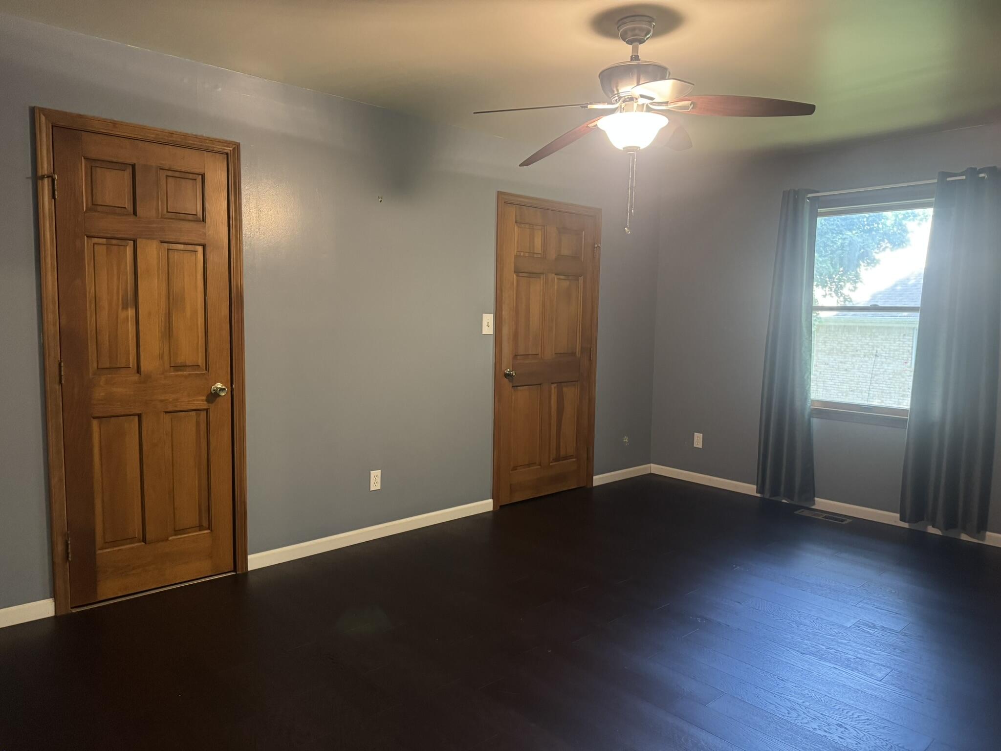 641 D Begonia Street Southeast De Motte, IN 46310 - Photo 30 of 39 an empty room with wooden floor closet and windows