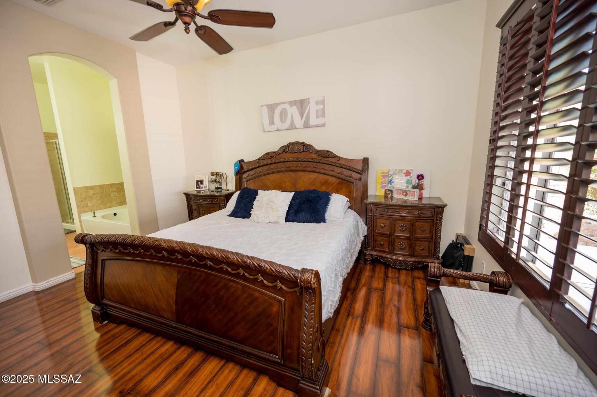 331 Via Bella Donna Rio Rico, AZ 85648 - Photo 29 of 46 a bedroom with a bed and wooden floor