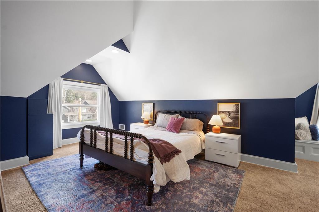 419 Oliver Road Sewickley, PA 15143 - Photo 15 of 34 a bedroom with a bed and a dresser next to a window