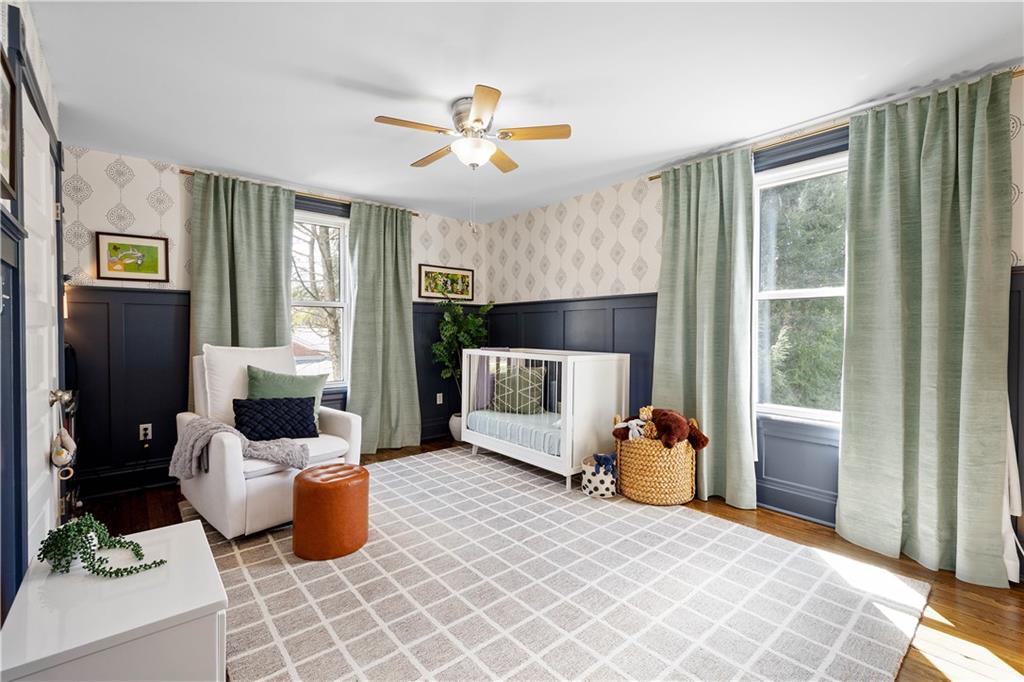 419 Oliver Road Sewickley, PA 15143 - Photo 19 of 34 a bedroom with a bed and ceiling fan