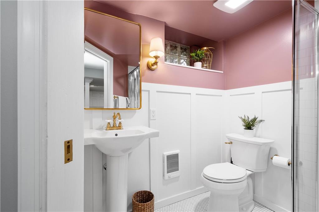 419 Oliver Road Sewickley, PA 15143 - Photo 27 of 34 a bathroom with a sink mirror and toilet