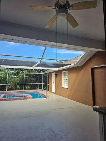 a backyard of a house with wooden floor