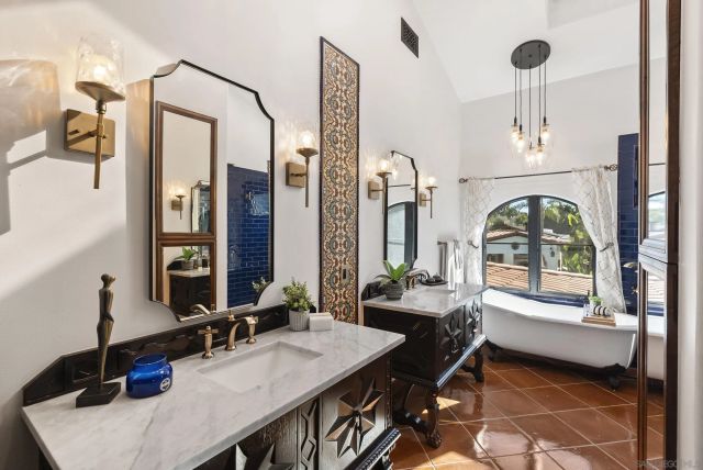 a bathroom with a bathtub and a sink