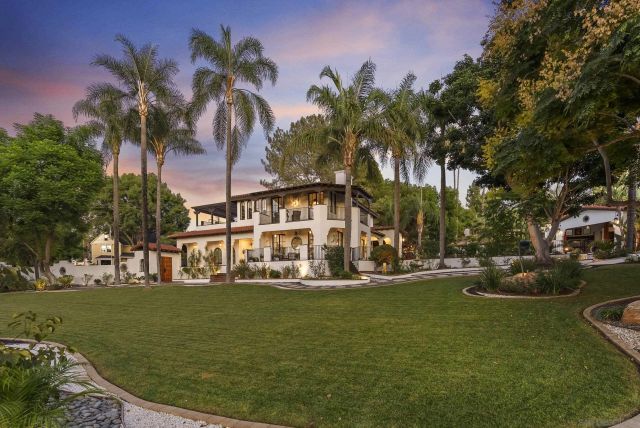 a view of a swimming pool with a garden