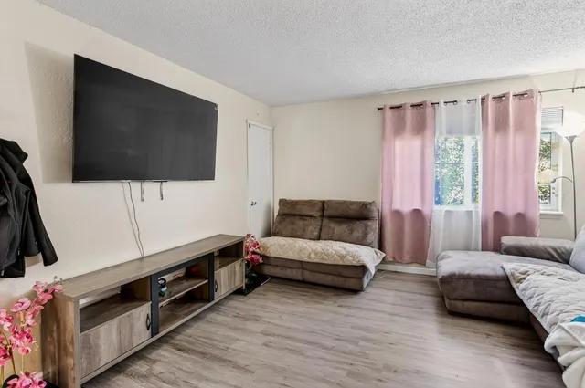a kitchen with a sink appliances and cabinets
