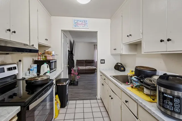 a bathroom with a sink mirror vanity and toilet