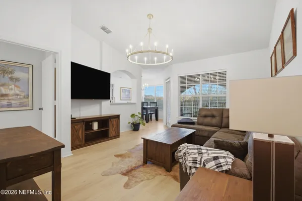 a living room with furniture and a large window