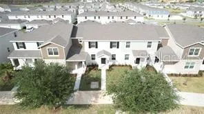 a front view of a building with a yard