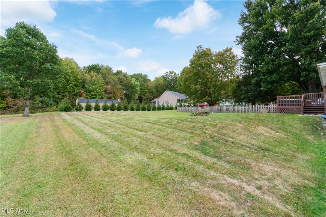 1701 Rheam Road Clinton, OH 44216 - Photo 30 of 31 View of yard featuring a wooden deck