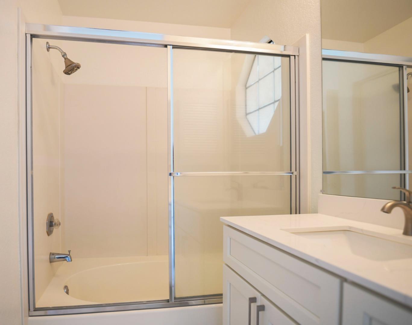 584 Valeri Ruth Court Santa Clara, CA 95050 - Photo 17 of 27 a bathroom with a shower and a sink