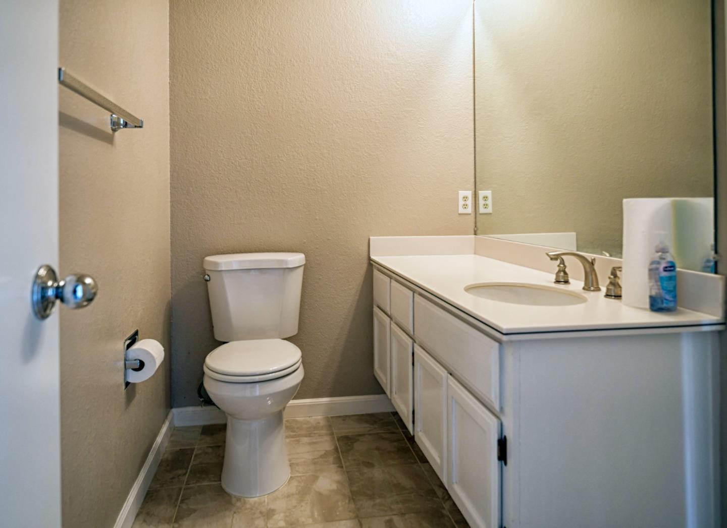 584 Valeri Ruth Court Santa Clara, CA 95050 - Photo 18 of 27 a bathroom with a sink toilet and a mirror