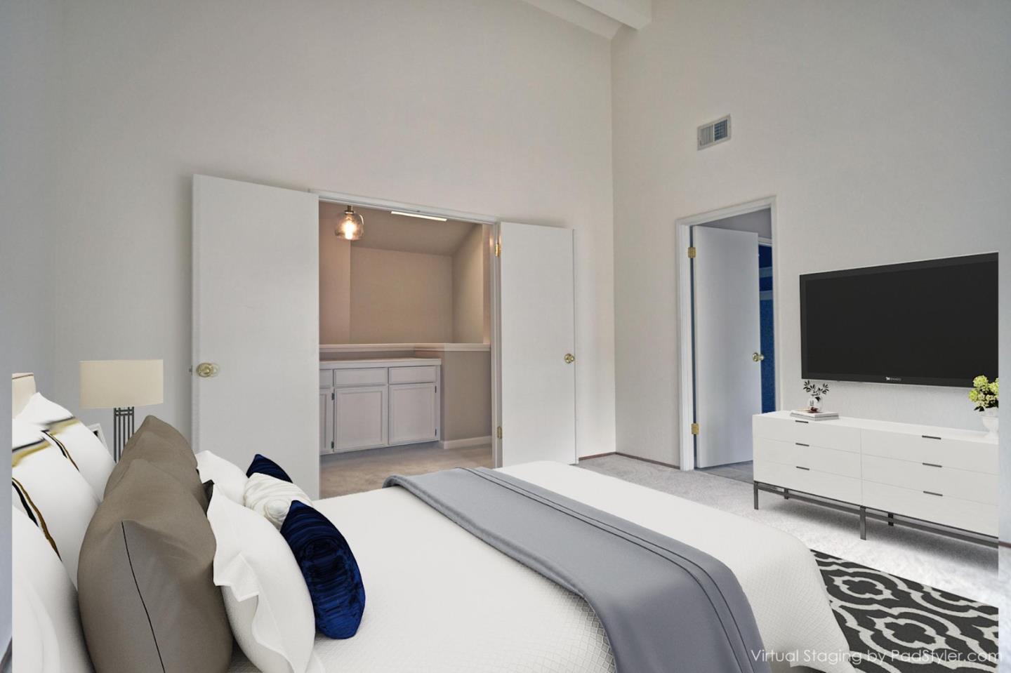 584 Valeri Ruth Court Santa Clara, CA 95050 - Photo 24 of 27 a bedroom with a bed and a flat screen tv