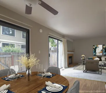 a living room with furniture a rug and a large window