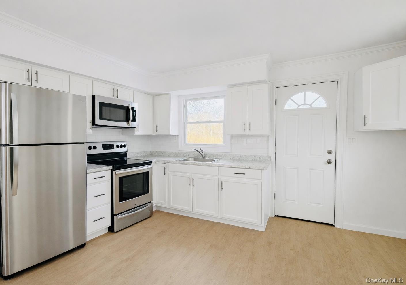 79 Johns Neck Road Shirley, NY 11967 - Photo 3 of 11 a kitchen with stainless steel appliances granite countertop a refrigerator stove a sink and dishwasher