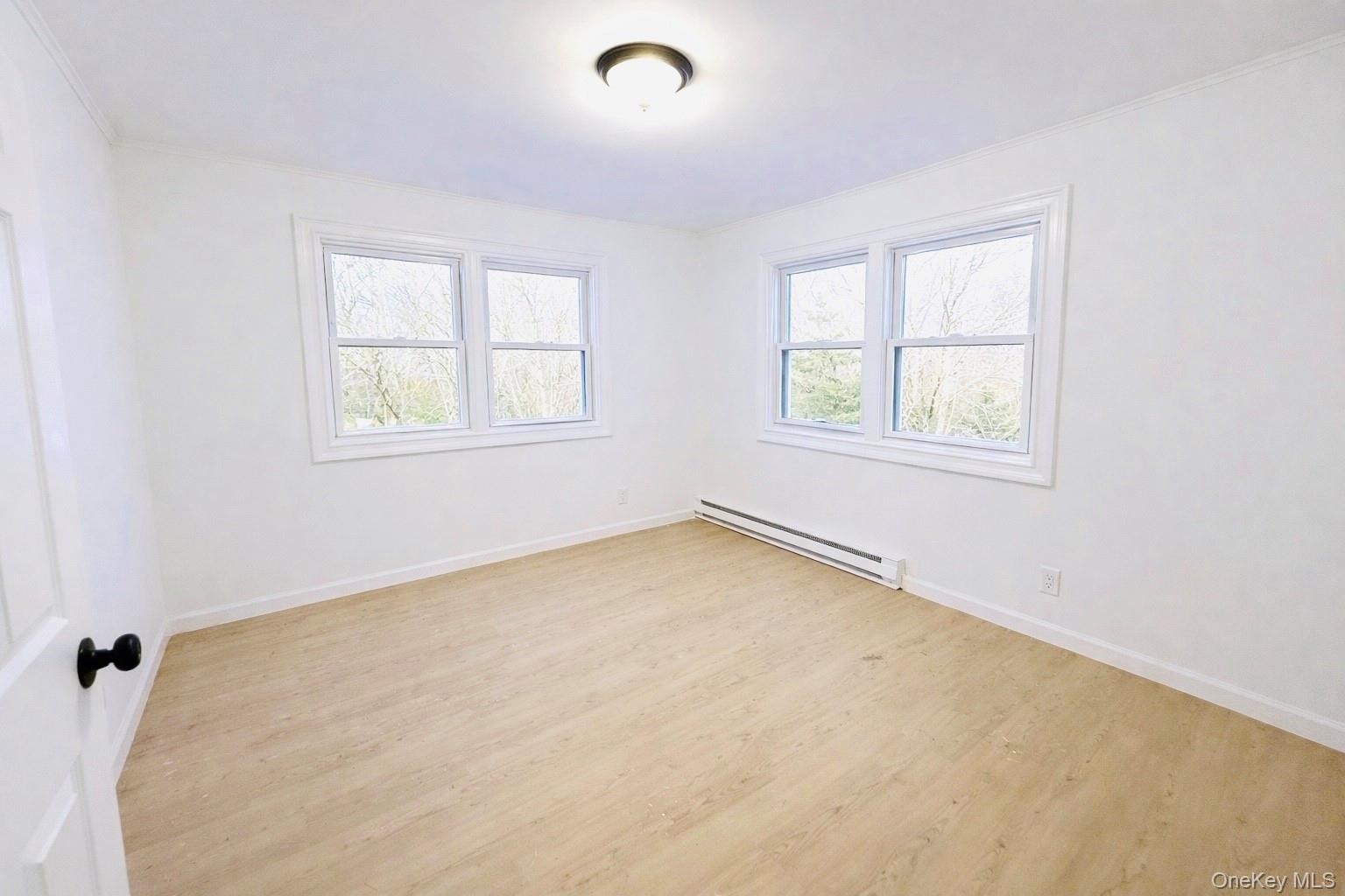 79 Johns Neck Road Shirley, NY 11967 - Photo 4 of 11 an empty room with a window