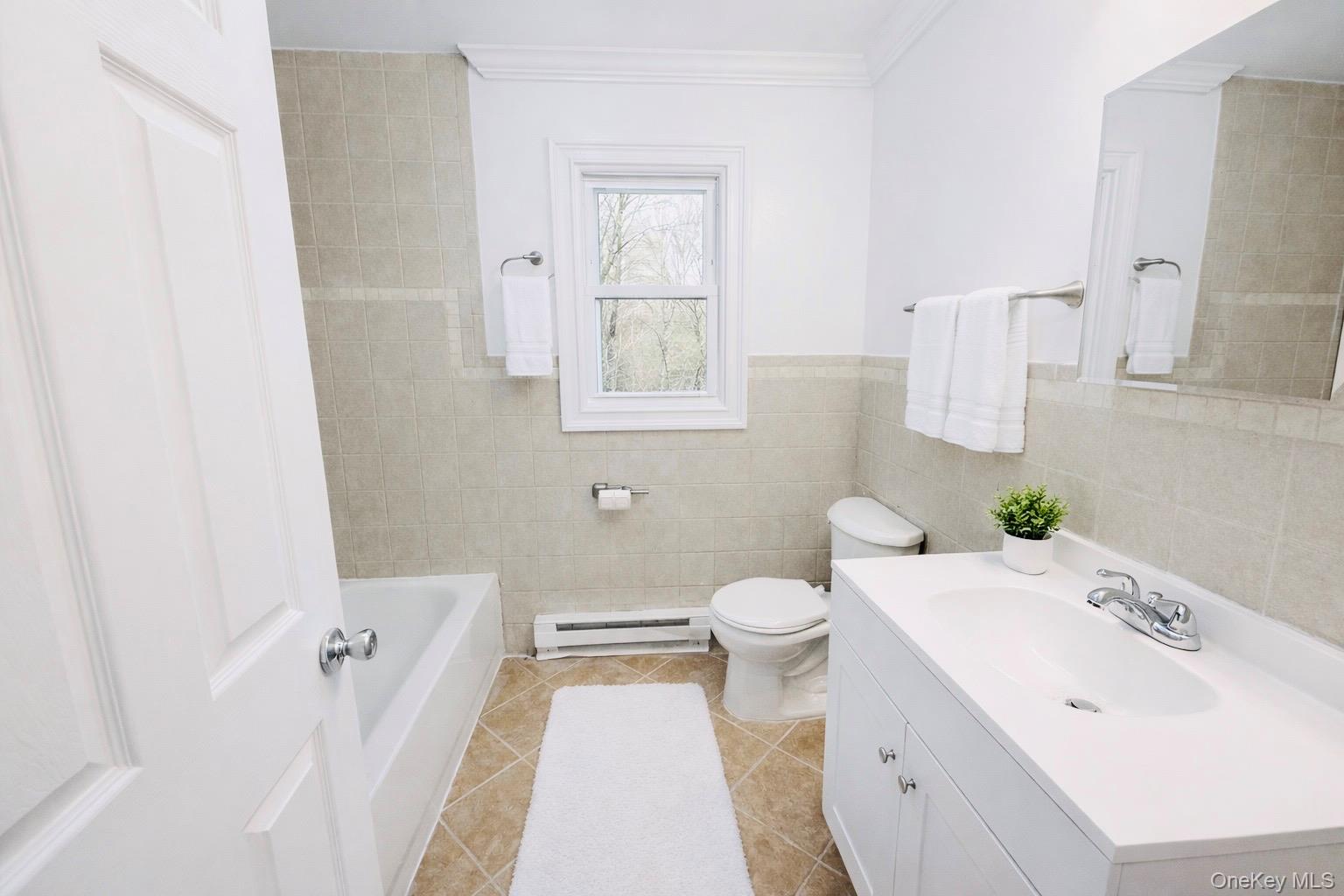 79 Johns Neck Road Shirley, NY 11967 - Photo 5 of 11 a bathroom with a sink and a toilet