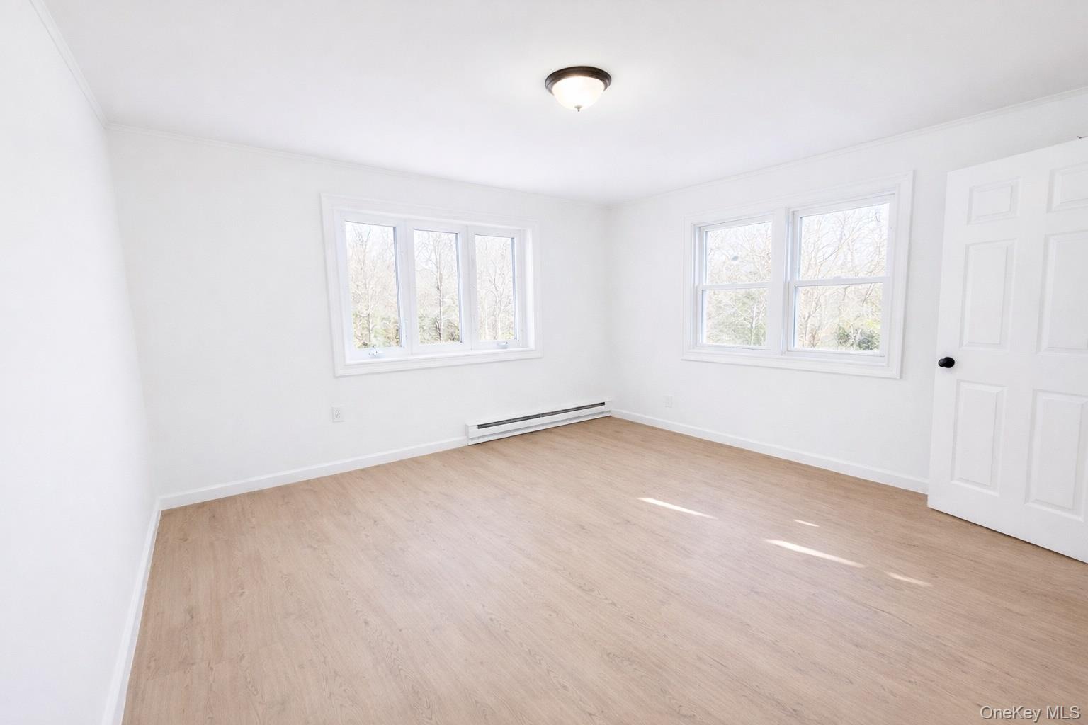 79 Johns Neck Road Shirley, NY 11967 - Photo 6 of 11 an empty room with windows