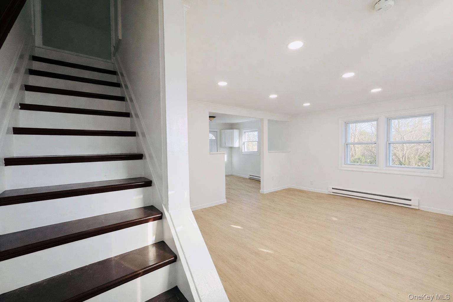 79 Johns Neck Road Shirley, NY 11967 - Photo 7 of 11 a view of an empty room with a window