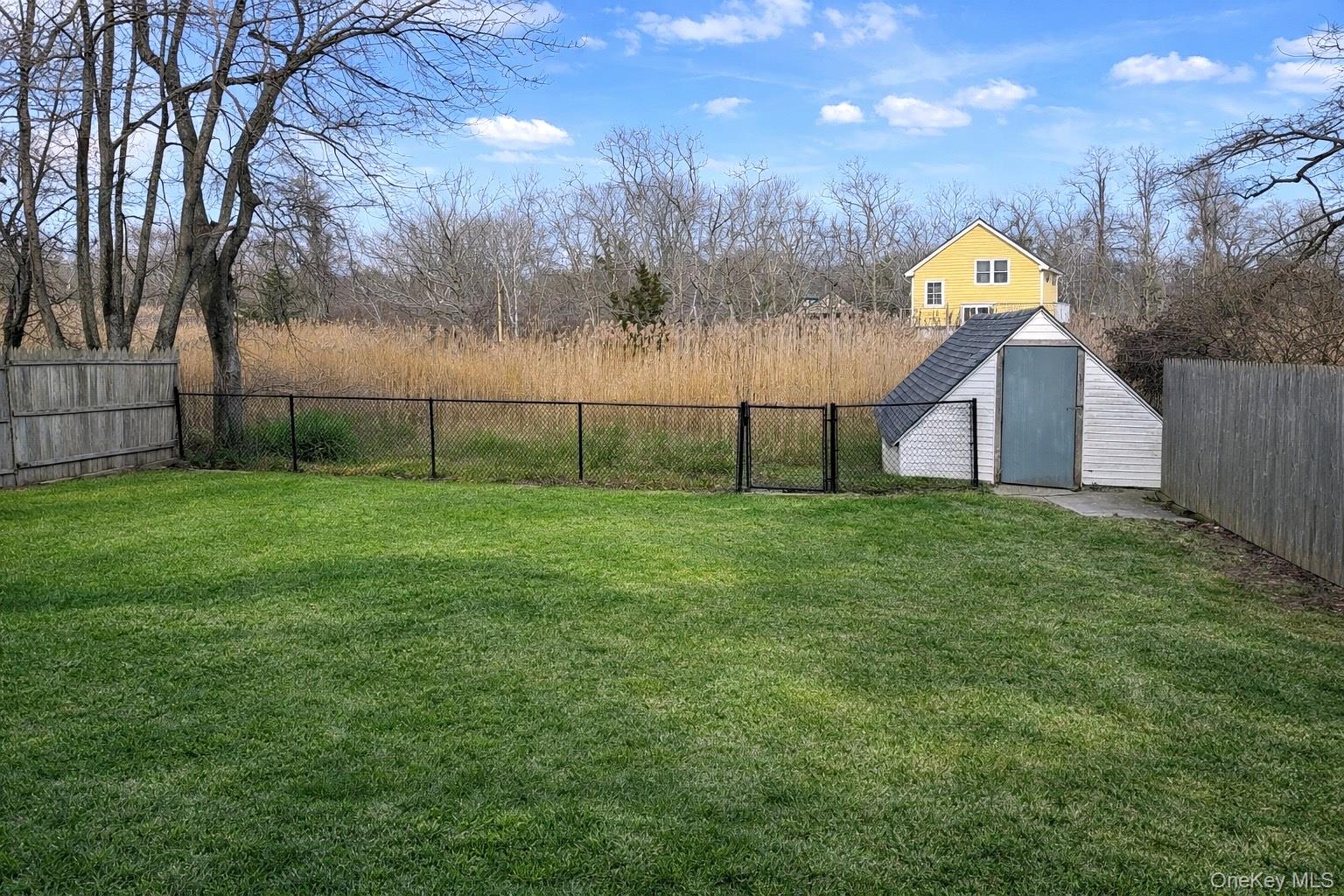79 Johns Neck Road Shirley, NY 11967 - Photo 9 of 11 a view of outdoor space and yard