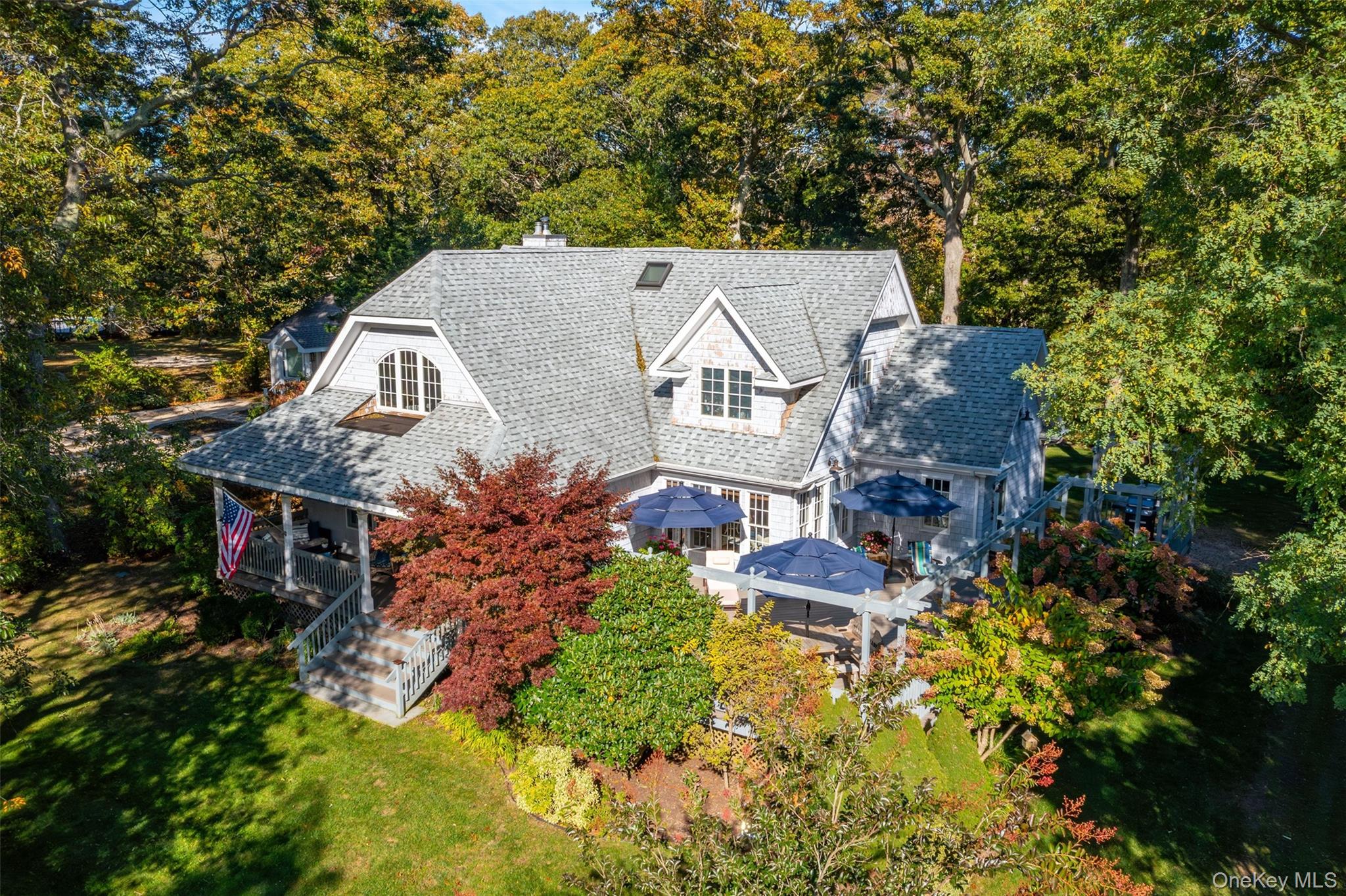 3600 Rocky Point Road East Marion, NY 11939 - Photo 42 of 45 an aerial view of a house with a yard swimming pool a patio and outdoor seating