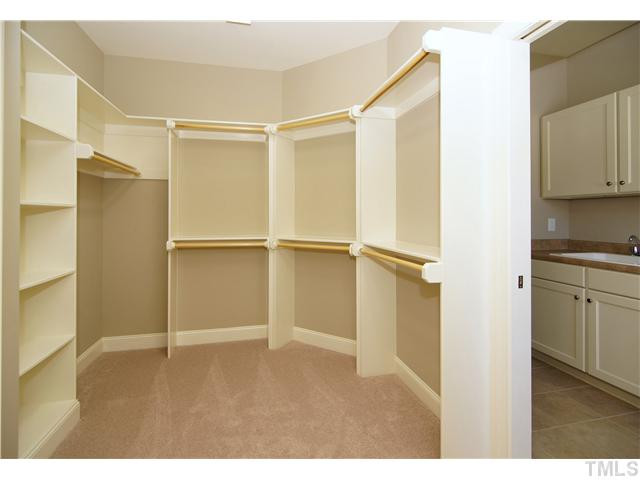 2800 Romelia Lane Raleigh, NC 27613 - Photo 20 of 22 Master Closet opens to Laundry room with a pocket door.