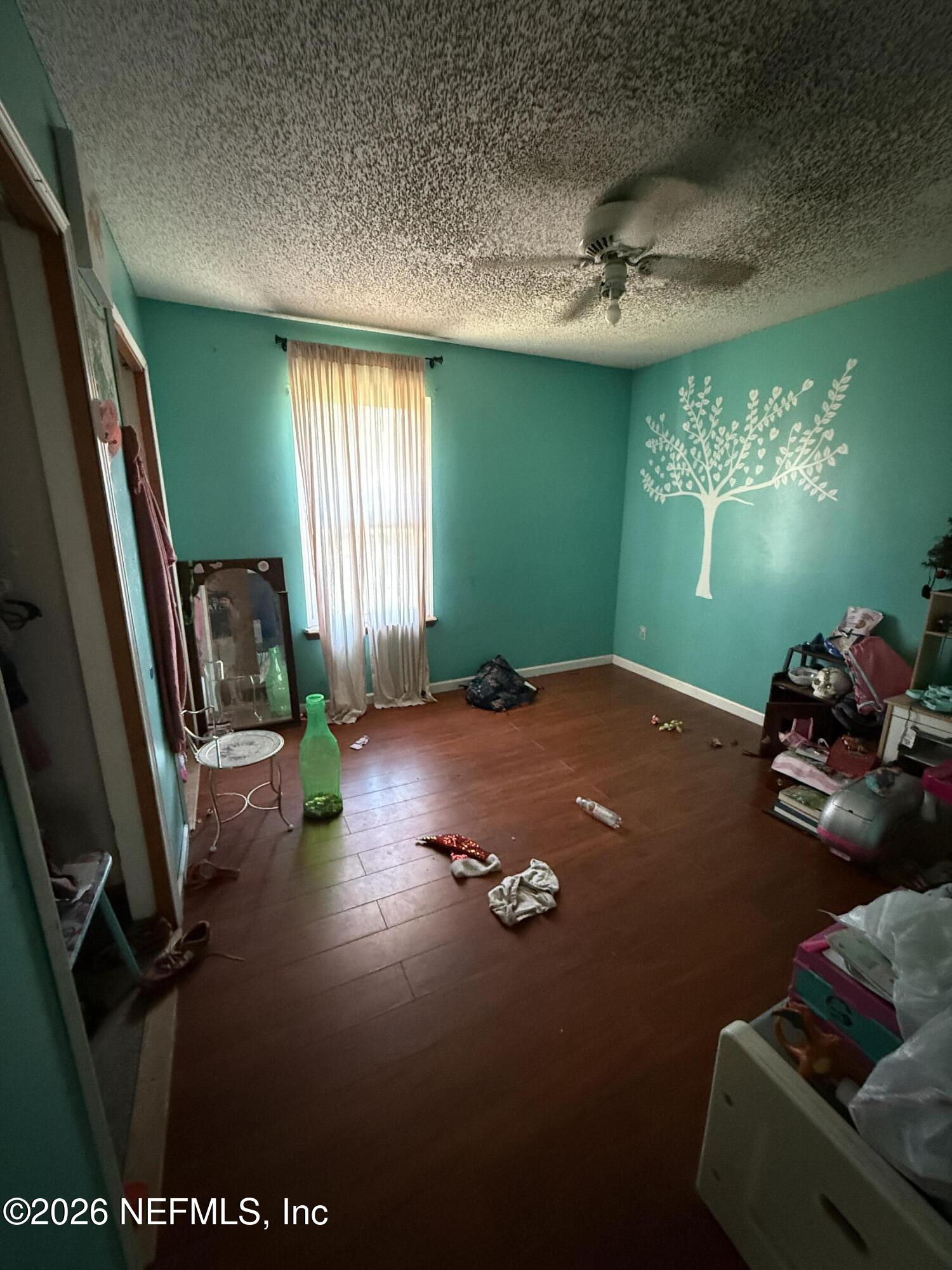 45 Mint Circle Middleburg, FL 32068 - Photo 13 of 24 a view of a livingroom with furniture and a ceiling fan