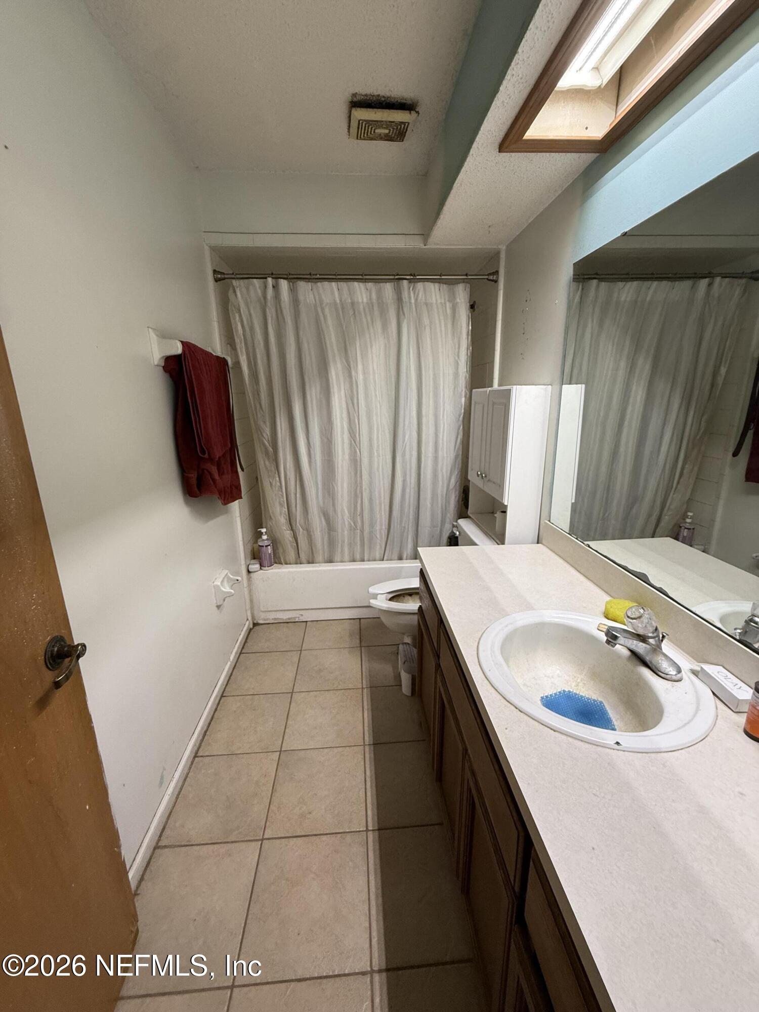 45 Mint Circle Middleburg, FL 32068 - Photo 15 of 24 a bathroom with a sink and a mirror