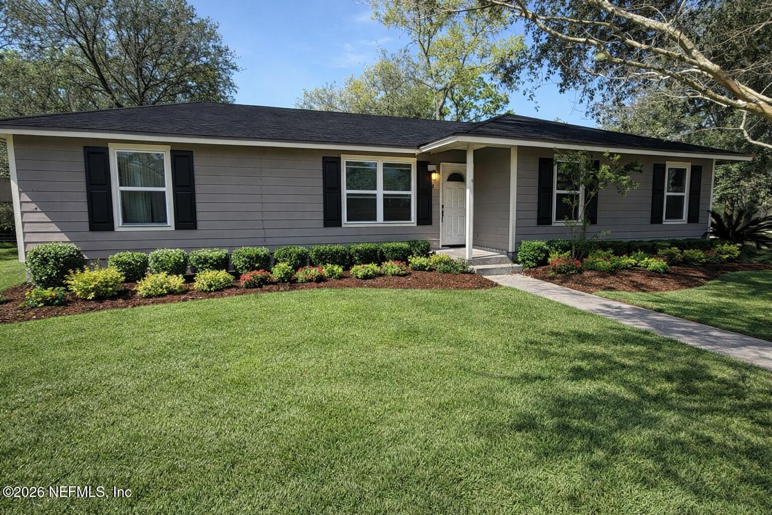 45 Mint Circle Middleburg, FL 32068 - Photo 2 of 24 a front view of house with yard and green space