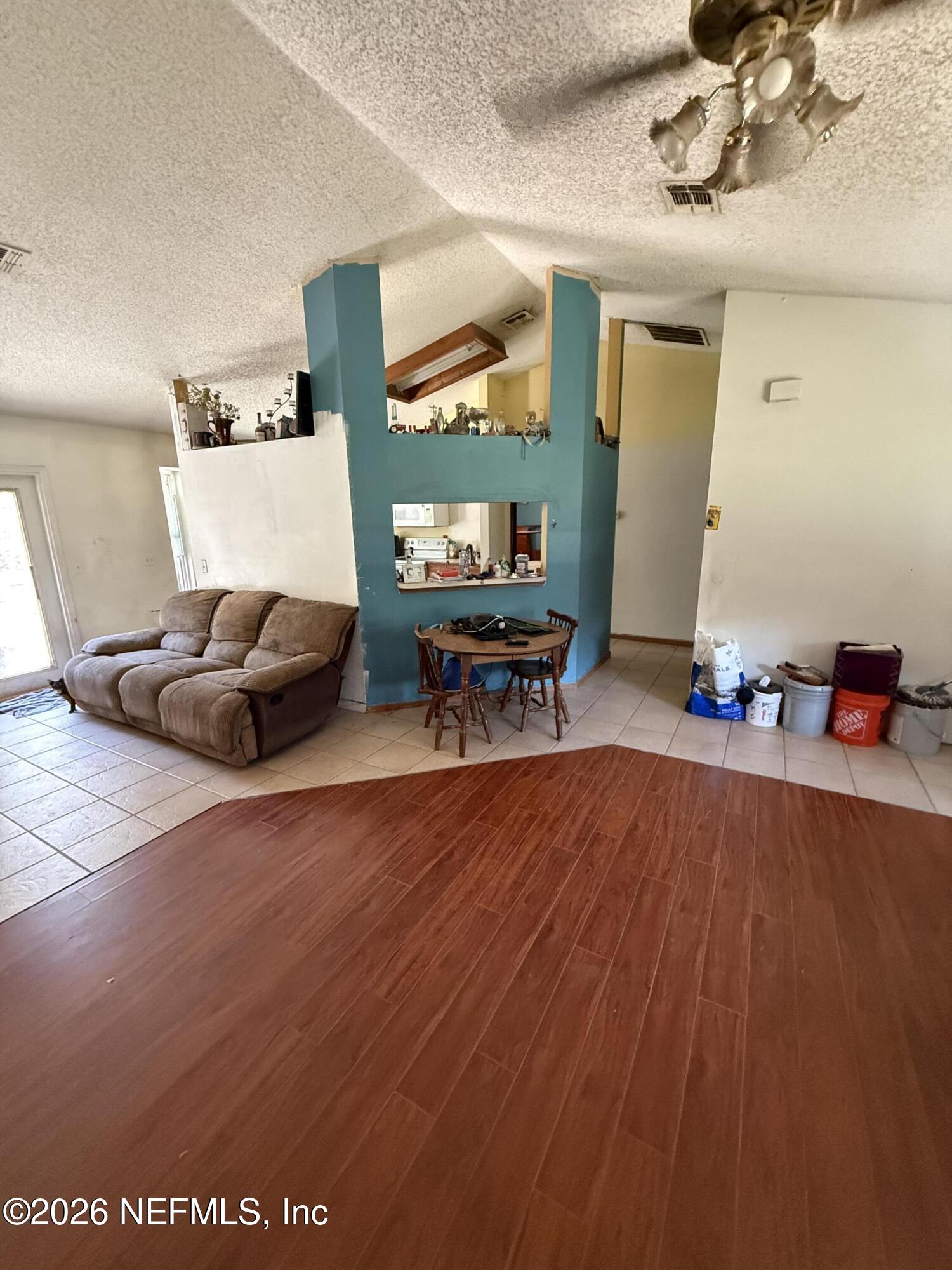 45 Mint Circle Middleburg, FL 32068 - Photo 6 of 24 a living room with furniture and a wooden floor