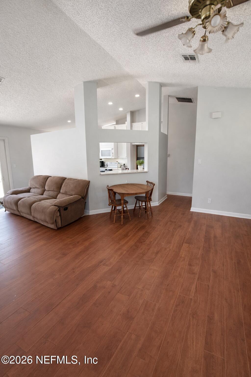 45 Mint Circle Middleburg, FL 32068 - Photo 7 of 24 a living room with furniture and a wooden floor
