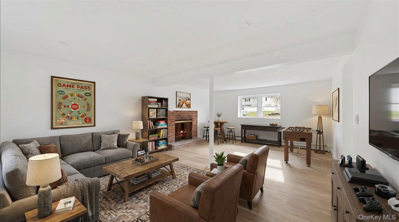 77 Friendly Road Mahopac, NY 10541 - Photo 28 of 36 Virtually Staged Family Room in basement that can be used as entertainment space, game room, etc.
